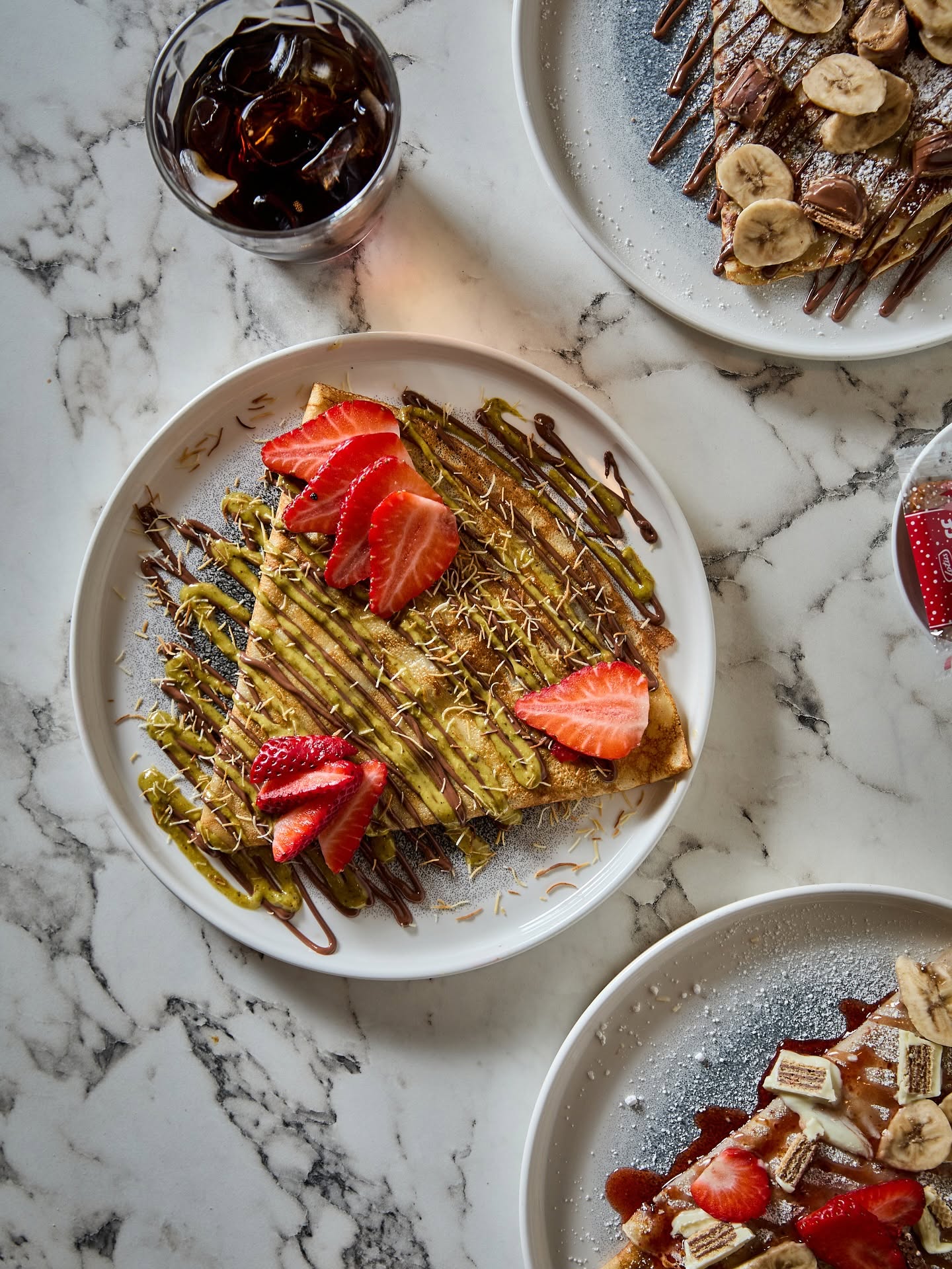 Madame Monsieur sweet French crepe with fresh strawberries and pistachio sauce in Budapest