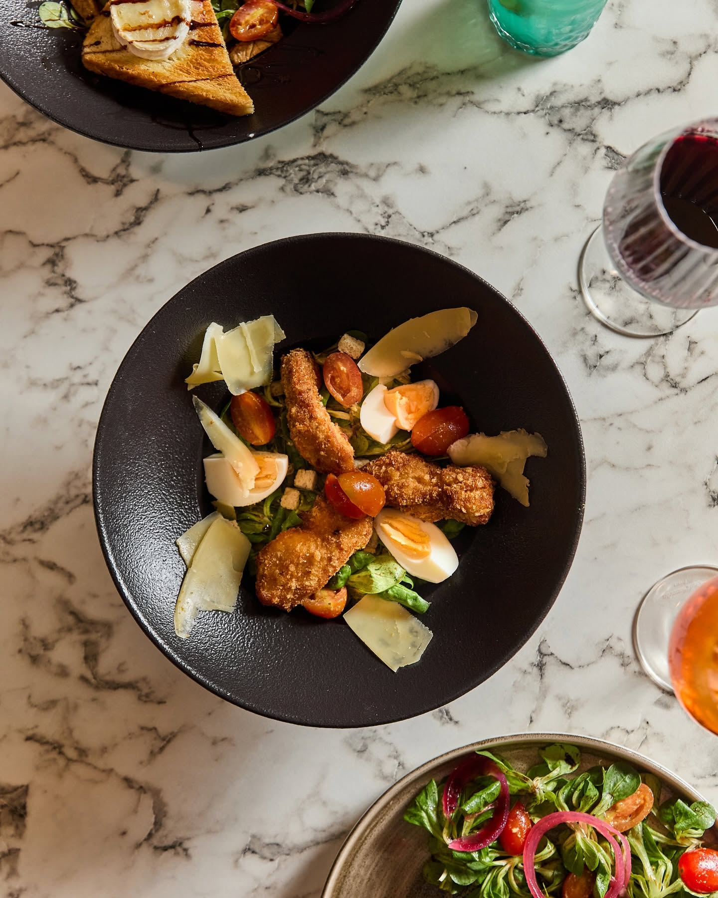 Madame Monsieur chicken Caesar salad with boiled eggs and parmesan cheese in Budapest