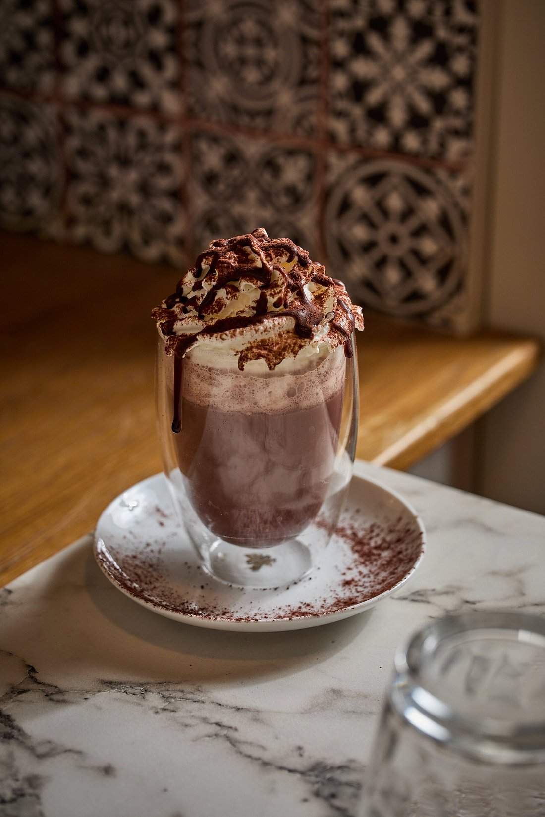 Madame Monsieur hot chocolate with whipped cream and chocolate syrup in Budapest